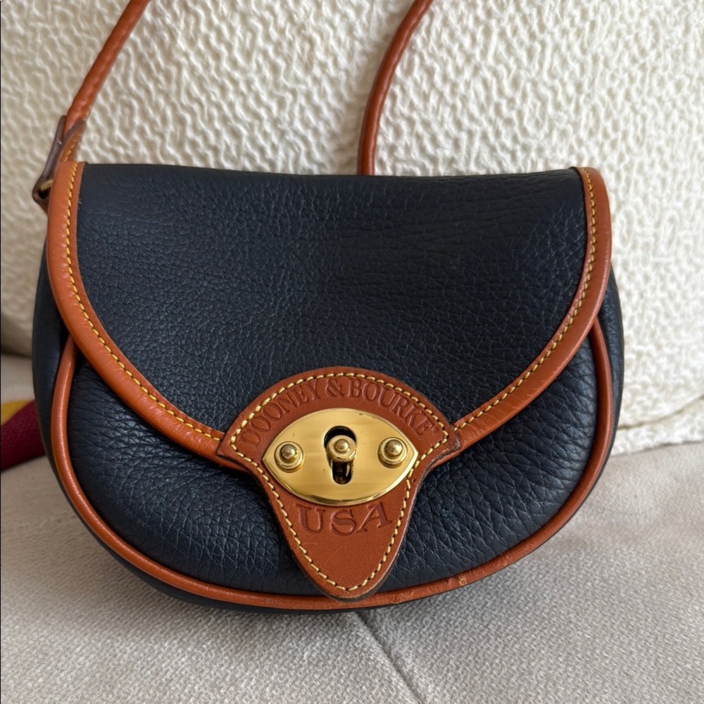Dooney & Bourke Black and Brown Crossbody Bag with Classic Saddle Style